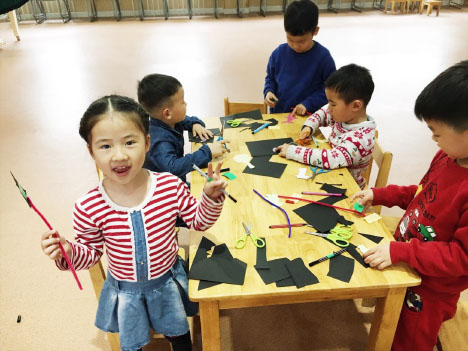 Youth participants holding their puppet selves.